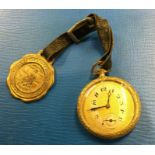 A gold plated slim pocket watch together with a me