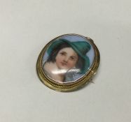 An attractive oval porcelain miniature of a lady i