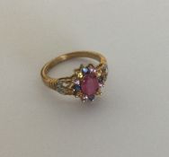 A small diamond mounted gem set cluster ring set i