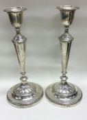 A large pair of Victorian sivler candlesticks. Lon