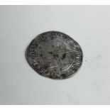 An old silver coin. Est. £10 - £20.