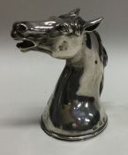 A rare silver stirrup cup in the form of a horse.