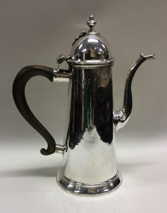 A George I silver chocolate pot with hinged lid. M