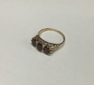 A garnet mounted half hoop ring in 9 carat. Approx