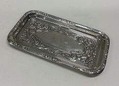 A chased silver dish. Sheffield 1910. By Walker &