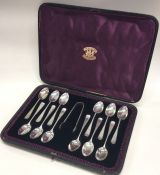 A cased set of twelve silver teaspoons together wi