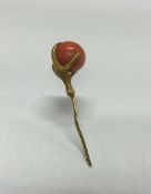 A good Antique high carat gold stick pin in the fo