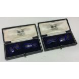 Two boxed pairs of matching cufflinks with crown e