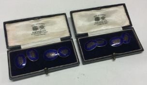 Two boxed pairs of matching cufflinks with crown e