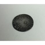 An early English silver coin. Est. £40 - £60.