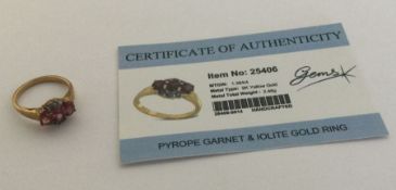 A pyrope garnet and iolite ring set in 9 carat. Ap