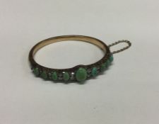 A good Victorian high carat gold hinged bracelet a