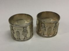 A heavy pair of cast silver napkin rings. London.