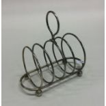 A silver toast rack / smartphone docking station.