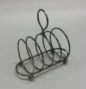 A silver toast rack / smartphone docking station.