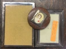 Three small silver picture frames together with a