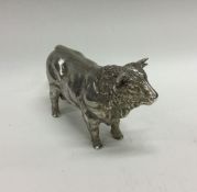A heavy silver cast figure of a cow. London 1993.