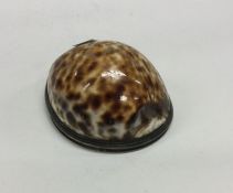 An 18th /19th Century silver mounted cowrie shell