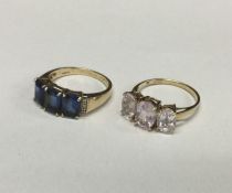 Two 9 carat three stone rings in claw mounts. Appr