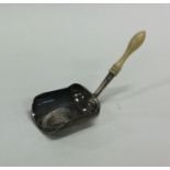 A good Georgian silver caddy scoop with turned han