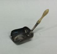 A good Georgian silver caddy scoop with turned han