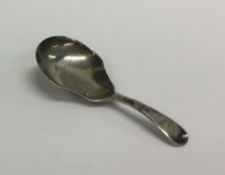 An OE pattern silver caddy spoon with crested term