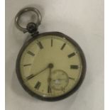 A silver open faced pocket watch. Est. £20 - £30.