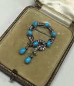 A good cased Victorian turquoise and diamond brooc