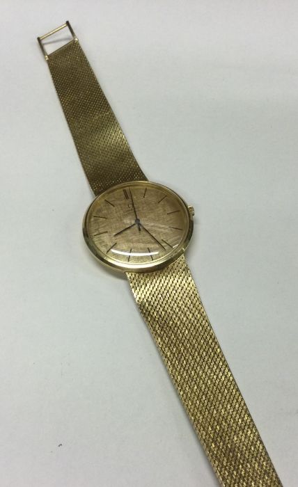OMEGA: A heavy gent's 18 carat gold wristwatch wit