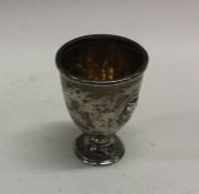 A good quality Victorian silver egg cup decorated