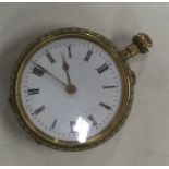 A lady's 18 carat gold fob watch with white enamel