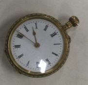 A lady's 18 carat gold fob watch with white enamel