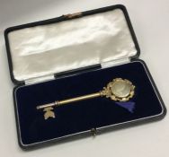 An English silver gilt cased key. Approx. grams. E