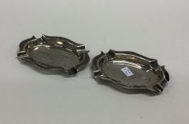 A pair of shaped edge silver ashtrays. Birmingham.