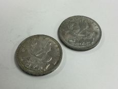 Two 1935 silver Crowns (coins). Est. £20 - £30.