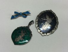 A silver and enamelled pendant together with a bro