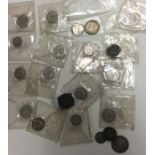 A quantity of silver coins. Est. £20 - £30.