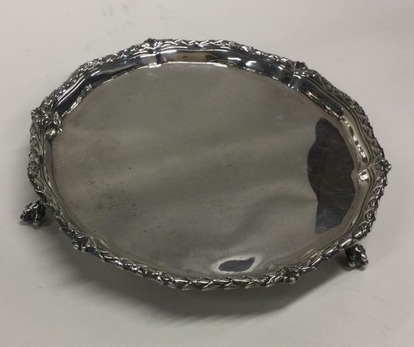A silver salver on ball feet. London 1776. By Hann - Image 2 of 2