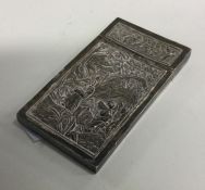 A chased 19th / 20th Century Chinese silver card c