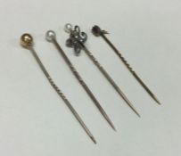 A good group of Antique gold stick pins mounted wi