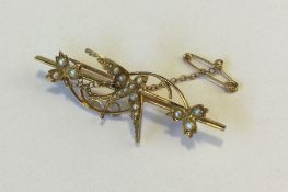 A Victorian pearl brooch decorated with a swallow
