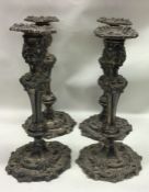 A good set of four Georgian silver candlesticks pr