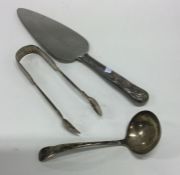 A pair of Georgian silver sugar tongs together wit