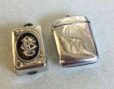 A heavy silver hinged top vesta case together with