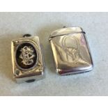 A heavy silver hinged top vesta case together with