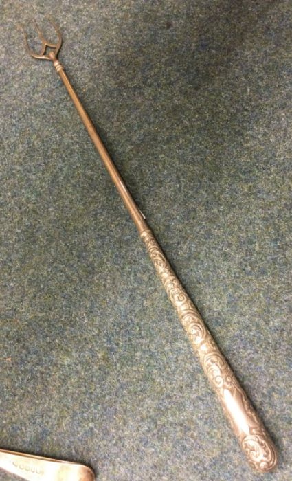 A good long tapering toasting fork with chased sil