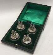 A good boxed set of four silver menu holders, each