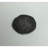 An early English silver coin. Est. £40 - £60.