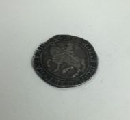 An early English silver coin. Est. £40 - £60.