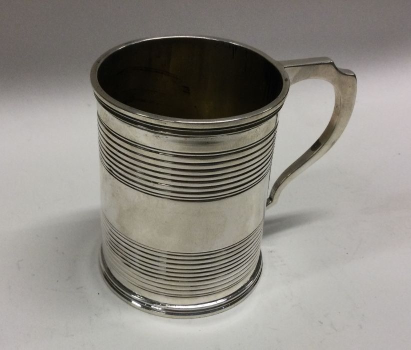A George III silver mug of reeded design. London 1 - Image 2 of 2